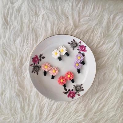 پک 2 عددی گیره انبری موی دخترانه طرح بابونه صورتی