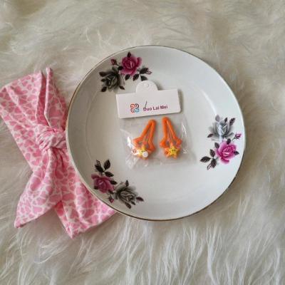 پک 2 عددی گیره مو تق تقی پیکسلی خارجی رنگ نارنجی