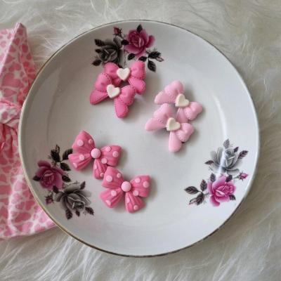 پک 2 عددی گیره انبری موی دخترانه طرح پاپیون رنگ صورتی